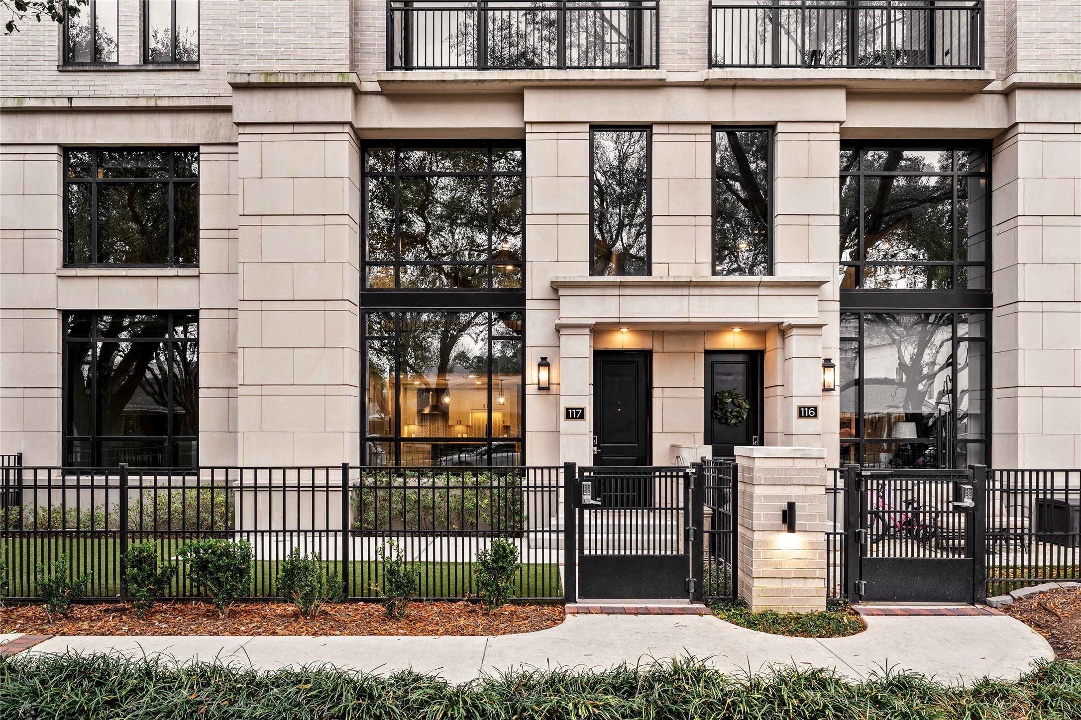 2511 Willowick Road, Unit 117 Houston, TX 77027 - Photo 2 of 43 a front view of a building with a garden