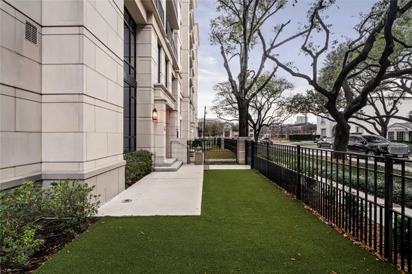 a view of a backyard with large trees