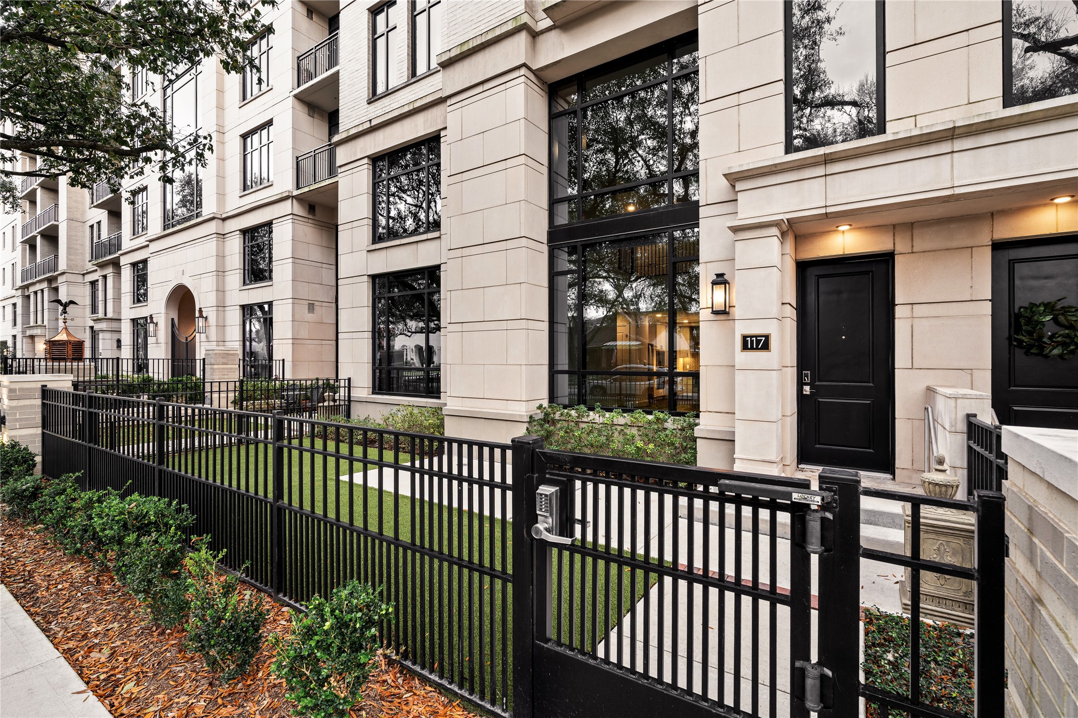 2511 Willowick Road, Unit 117 Houston, TX 77027 - Photo 4 of 43 a view of a brick building from a balcony