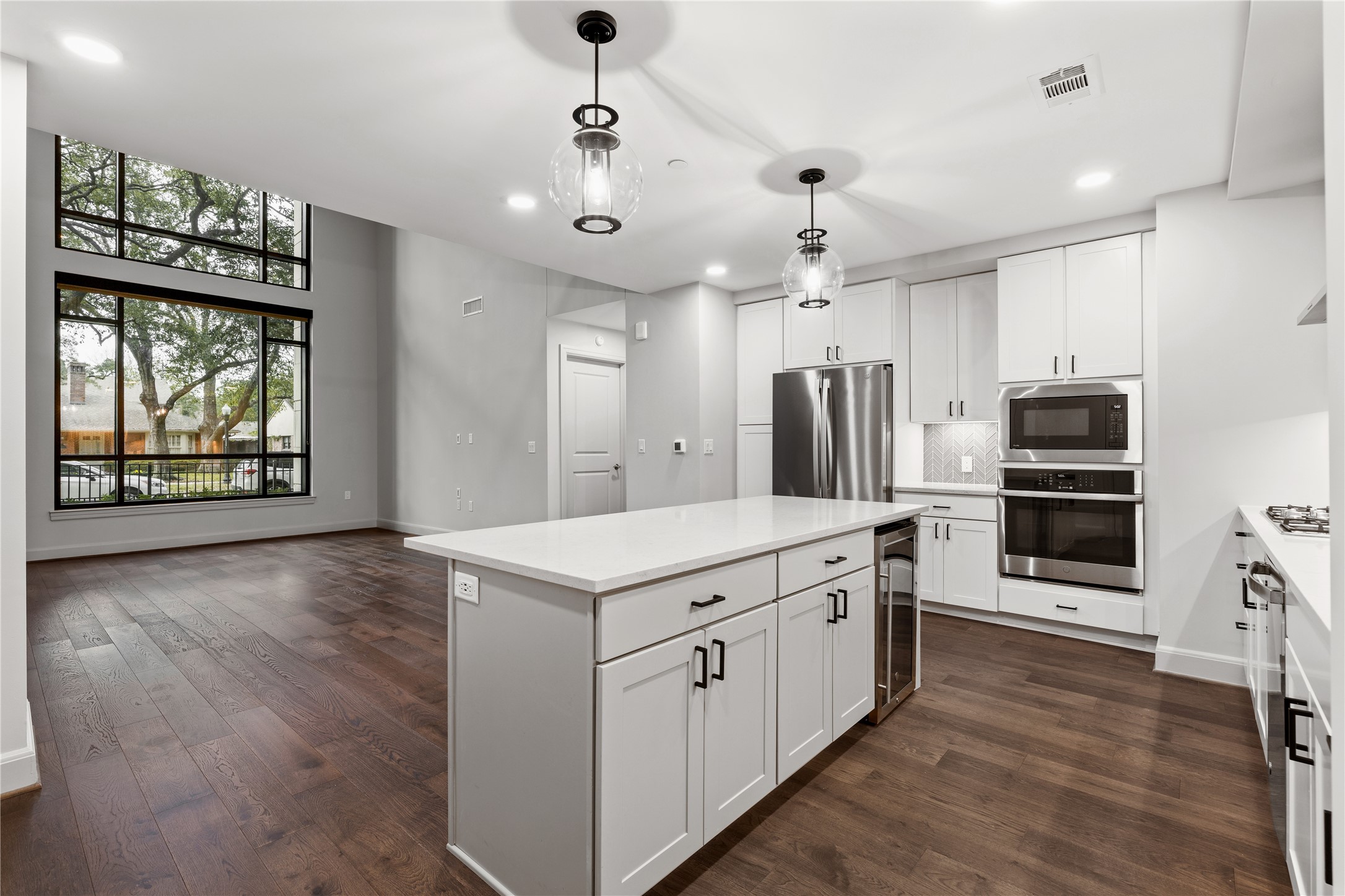 2511 Willowick Road, Unit 117 Houston, TX 77027 - Photo 6 of 43 a kitchen with stainless steel appliances a stove top oven and refrigerator