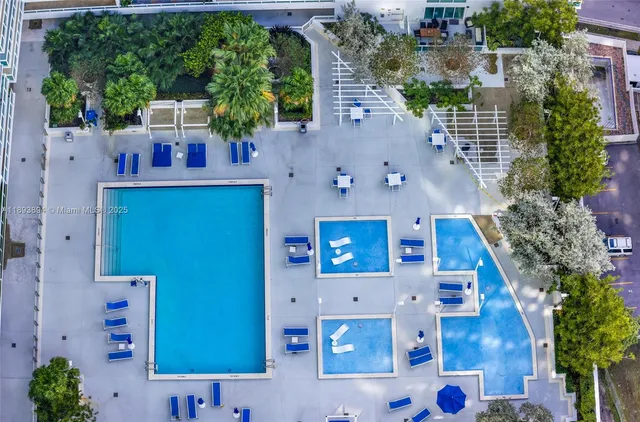 an aerial view of a house with outdoor space