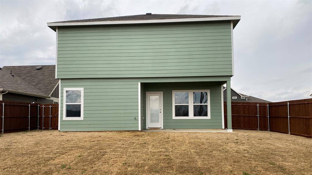 107 Hunters Way Canton, TX 75103 - Photo 3 of 23 Rear view of house featuring a patio area and a fenced backyard