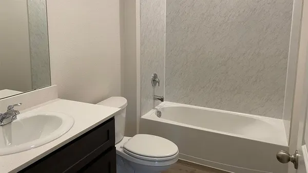 a bathroom with a sink and a bathtub