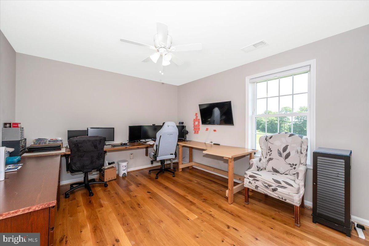 13226 Molasses Road Union Bridge, MD 21791 - Photo 50 of 78 a living room with furniture and a flat screen tv