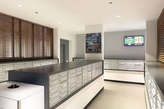 a kitchen with stainless steel appliances kitchen island granite countertop a sink and a microwave