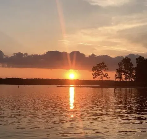 a view of ocean with sunset