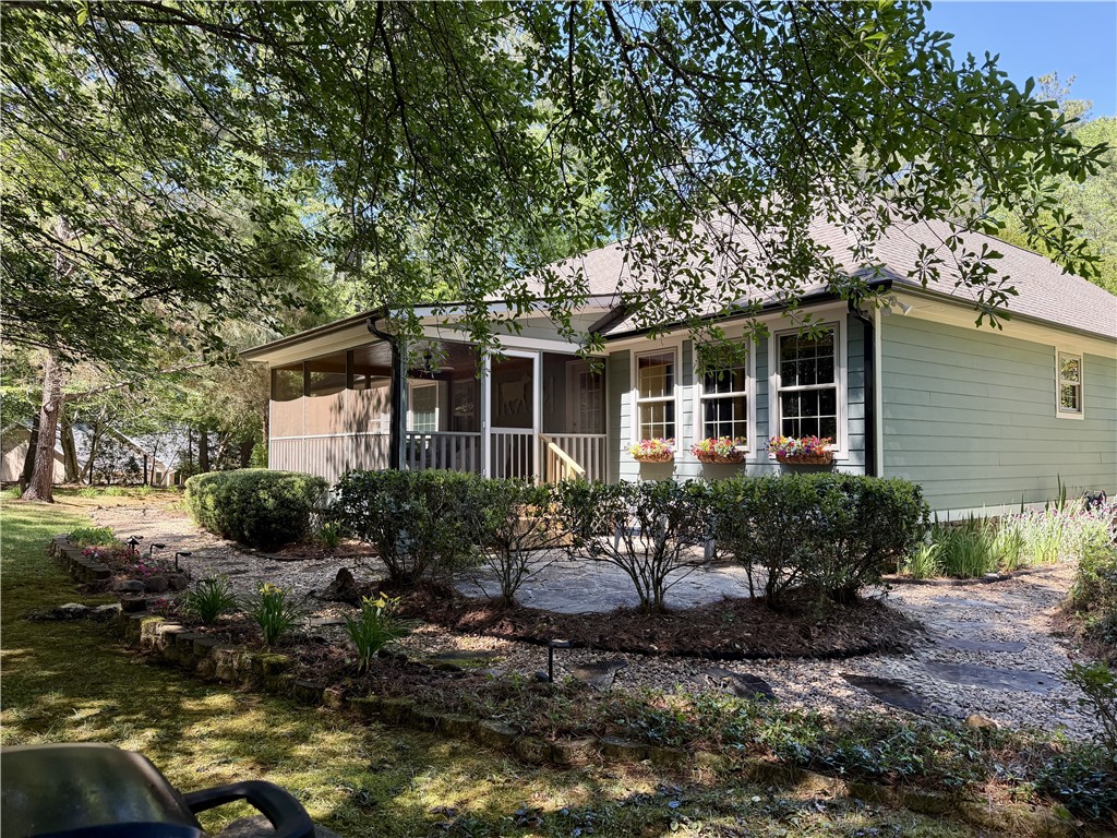 232 Hunters Trail Walhalla, SC 29691 - Photo 33 of 38 This inviting home offers charming curb appeal with a screened porch and lush landscaping.