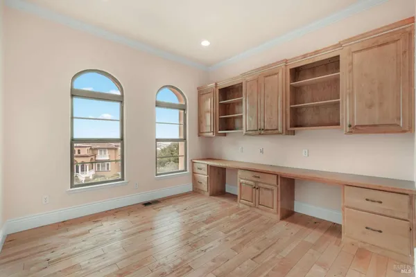 a view of a kitchen with dishwasher and wooden floor