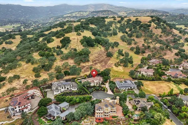 an aerial view of residential houses with outdoor space