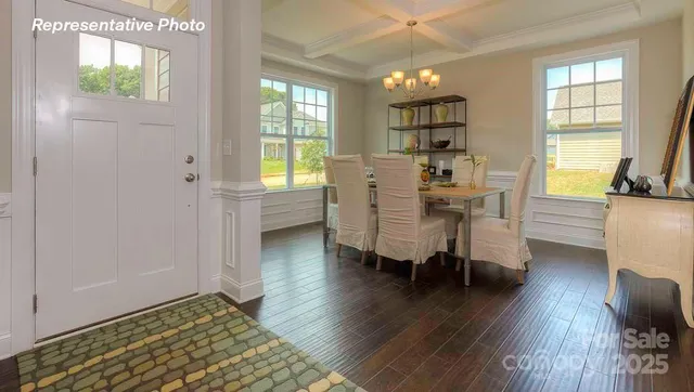 a view of a livingroom with furniture and a window