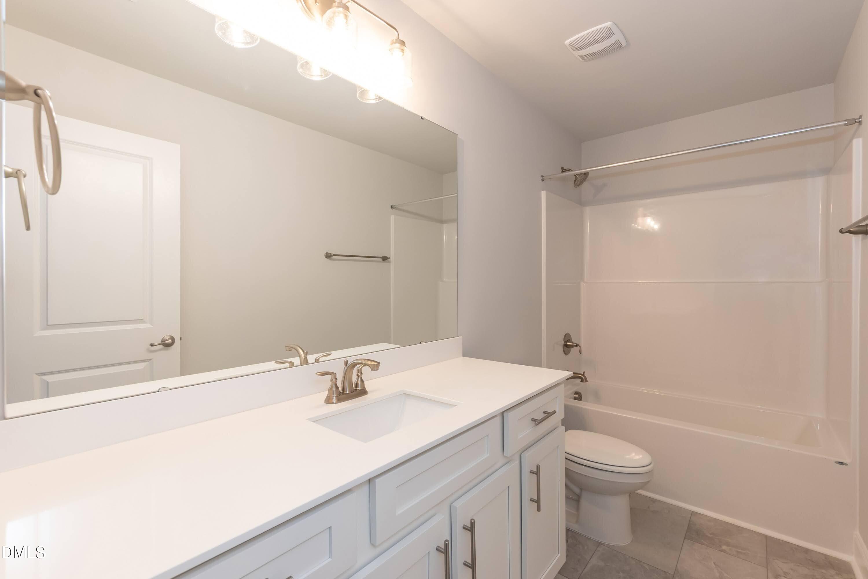 63 Leslie Court Middlesex, NC 27557 - Photo 16 of 21 a bathroom with a sink a toilet and shower