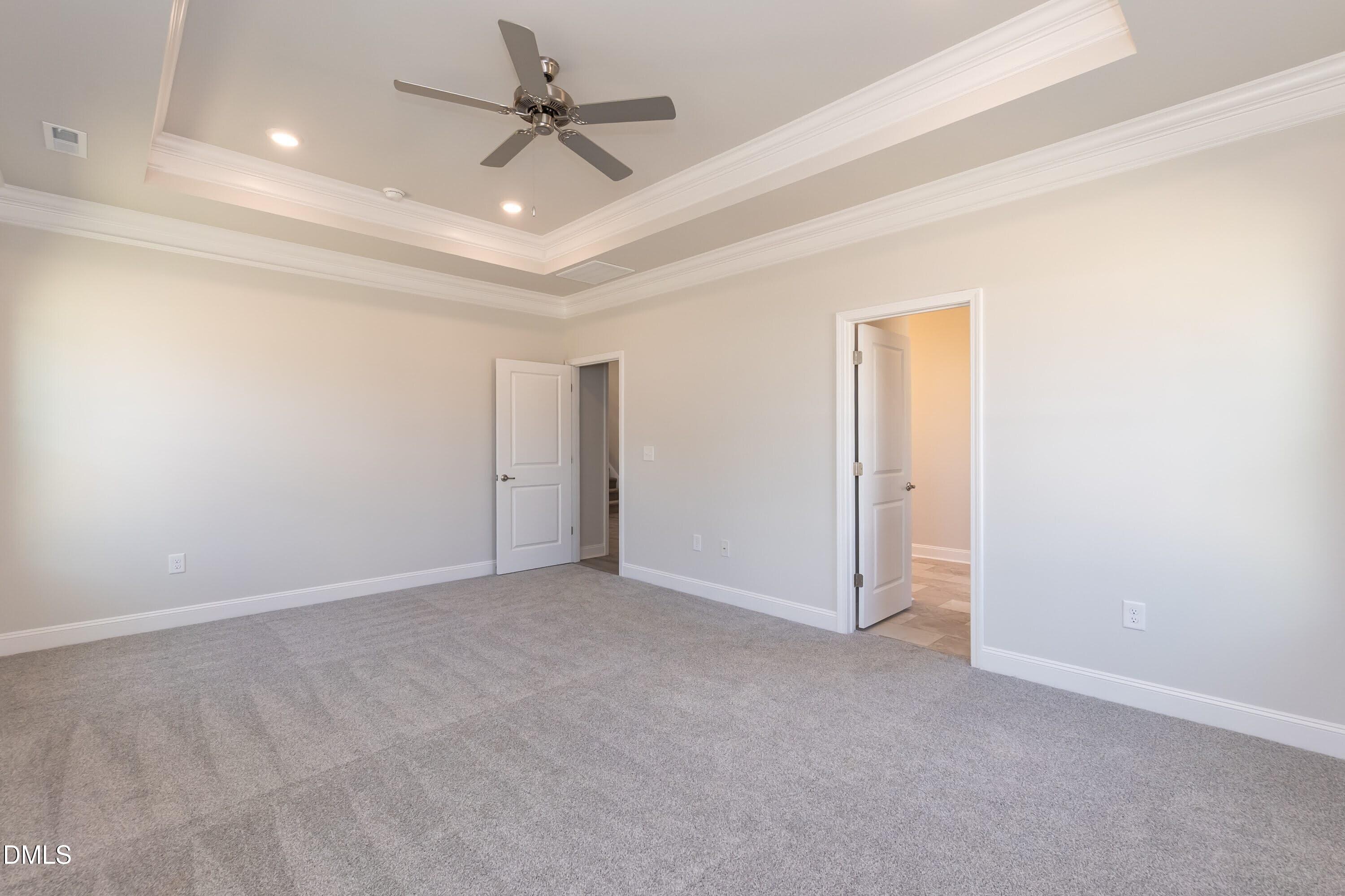 63 Leslie Court Middlesex, NC 27557 - Photo 7 of 21 an empty room with a ceiling fan and a ceiling fan