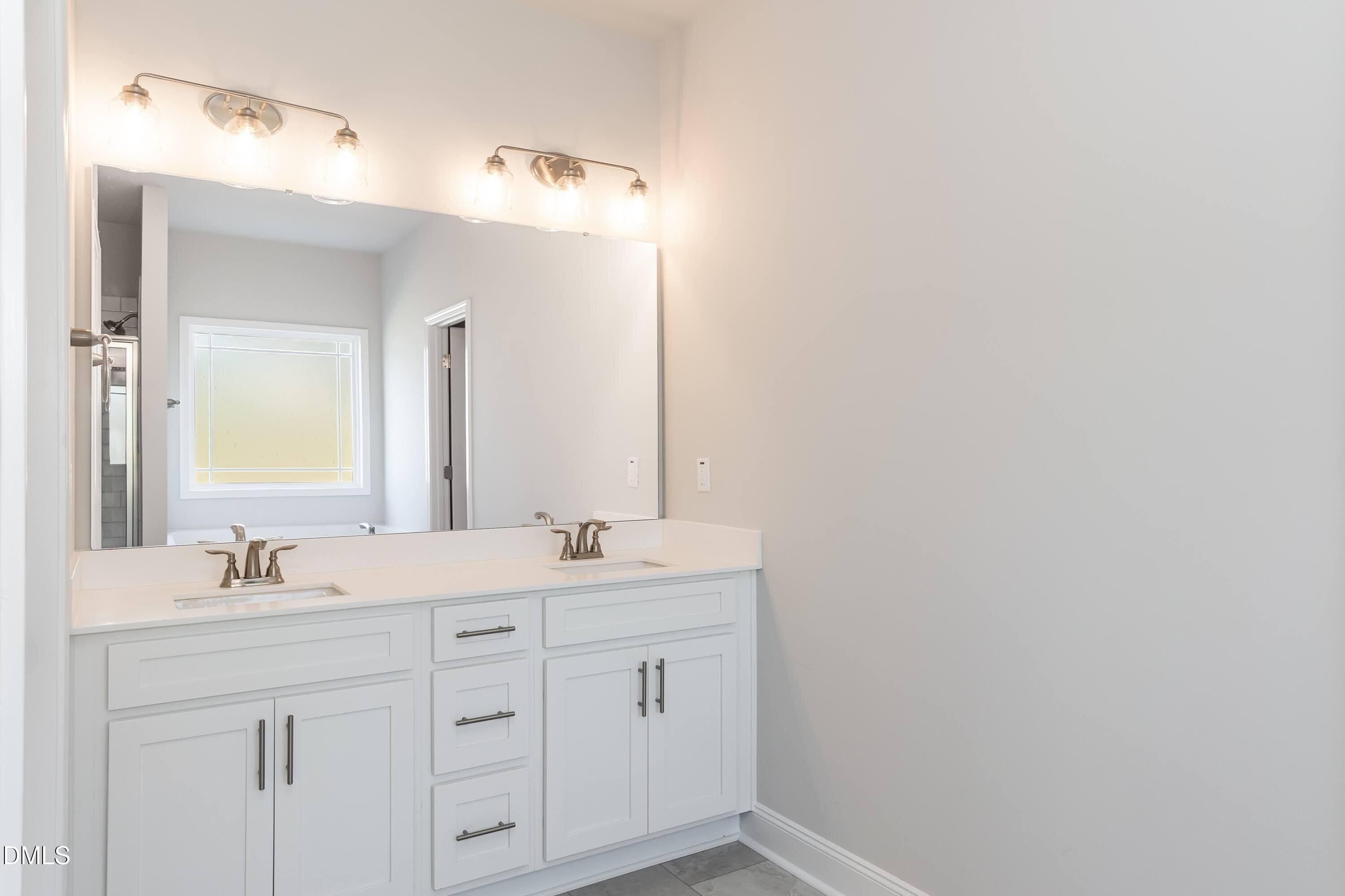 63 Leslie Court Middlesex, NC 27557 - Photo 8 of 21 a bathroom with a sink and a mirror
