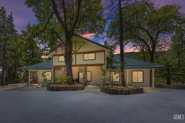 a view of a house with a tree
