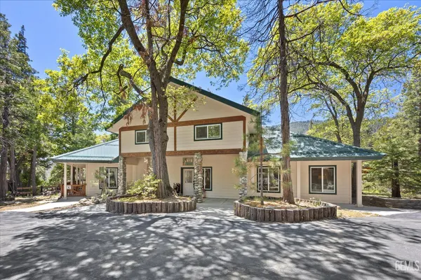 a living room with fireplace furniture and a fireplace