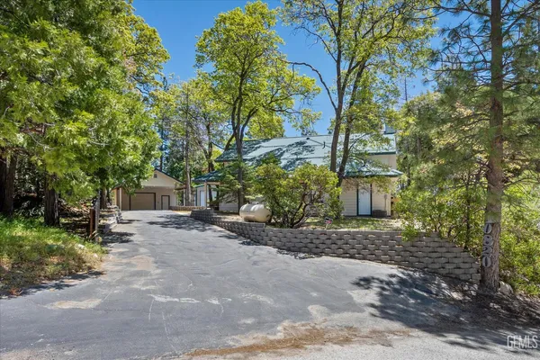 a kitchen with stainless steel appliances granite countertop a stove a sink and a granite counter tops