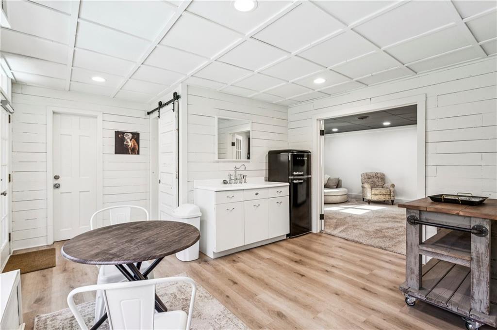 23 Midway Road Marietta, GA 30064 - Photo 21 of 32 a kitchen with a table chairs refrigerator and cabinets