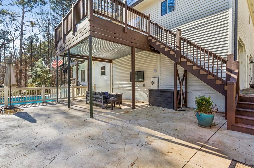 23 Midway Road Marietta, GA 30064 - Photo 25 of 32 a view of a dinning tables and chairs in backyard of the house