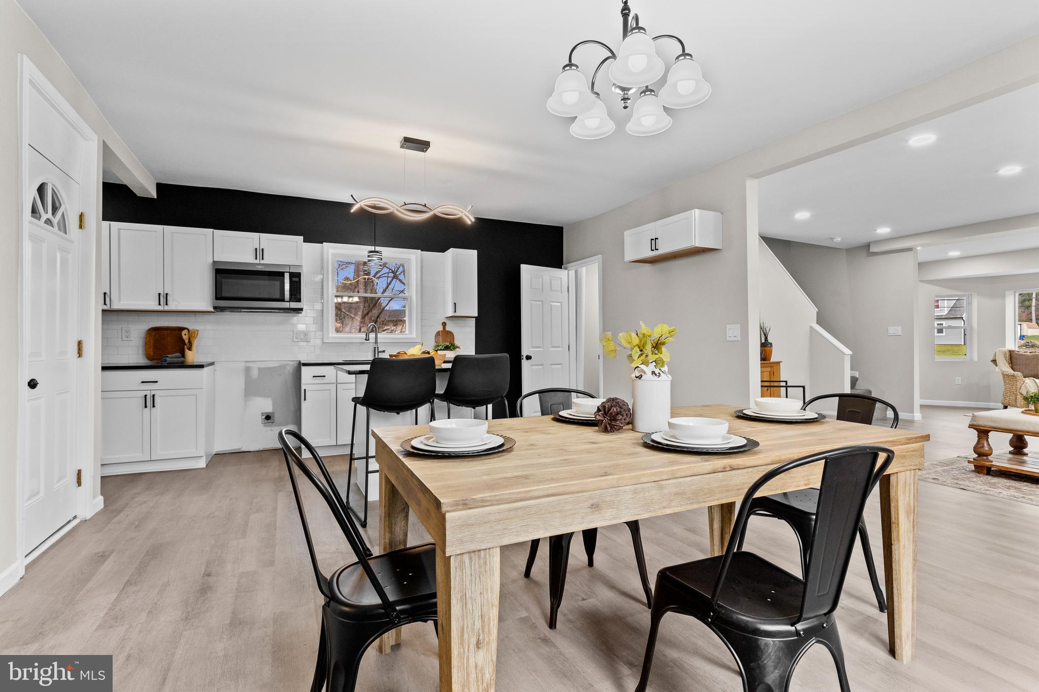 3507 Union Deposit Road Harrisburg, PA 17109 - Photo 11 of 37 a view of a dining room with furniture and wooden floor