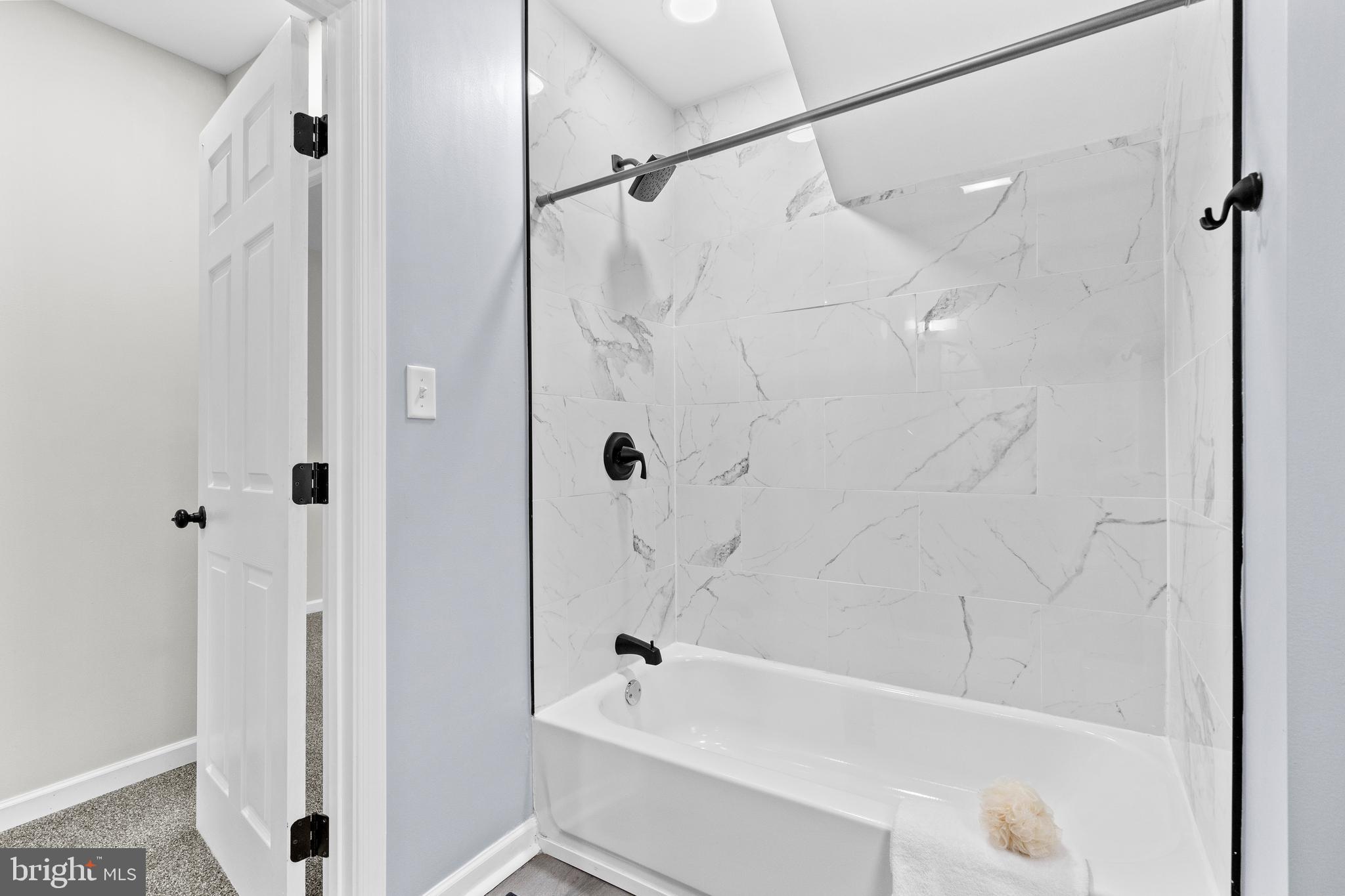 3507 Union Deposit Road Harrisburg, PA 17109 - Photo 22 of 37 a bathroom with a bathtub and a shower