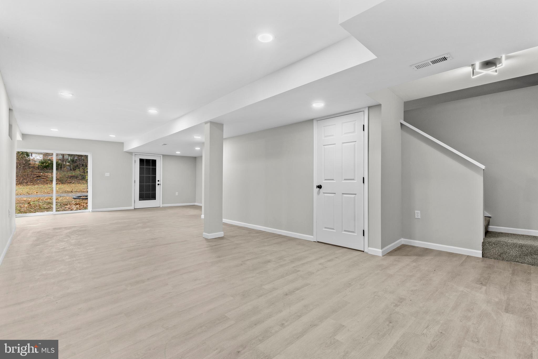 3507 Union Deposit Road Harrisburg, PA 17109 - Photo 25 of 37 a view of an empty room with wooden floor and windows