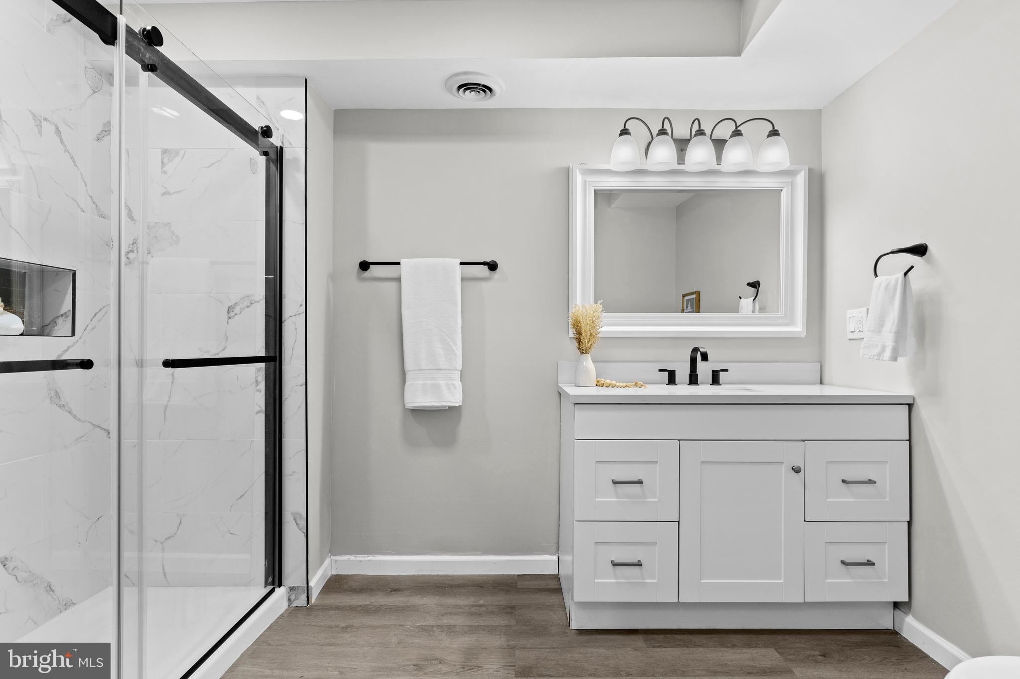 3507 Union Deposit Road Harrisburg, PA 17109 - Photo 27 of 37 a bathroom with a double vanity sink mirror and shower