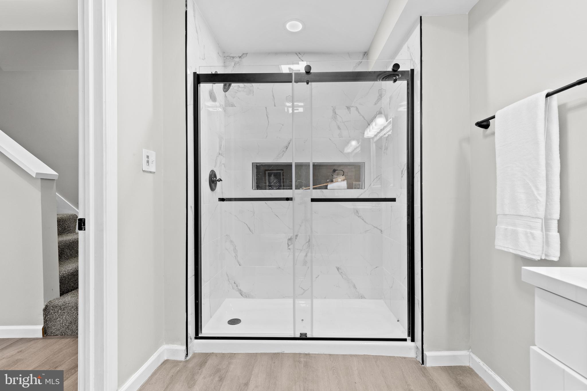 3507 Union Deposit Road Harrisburg, PA 17109 - Photo 28 of 37 a bathroom with a glass shower door and a mirror