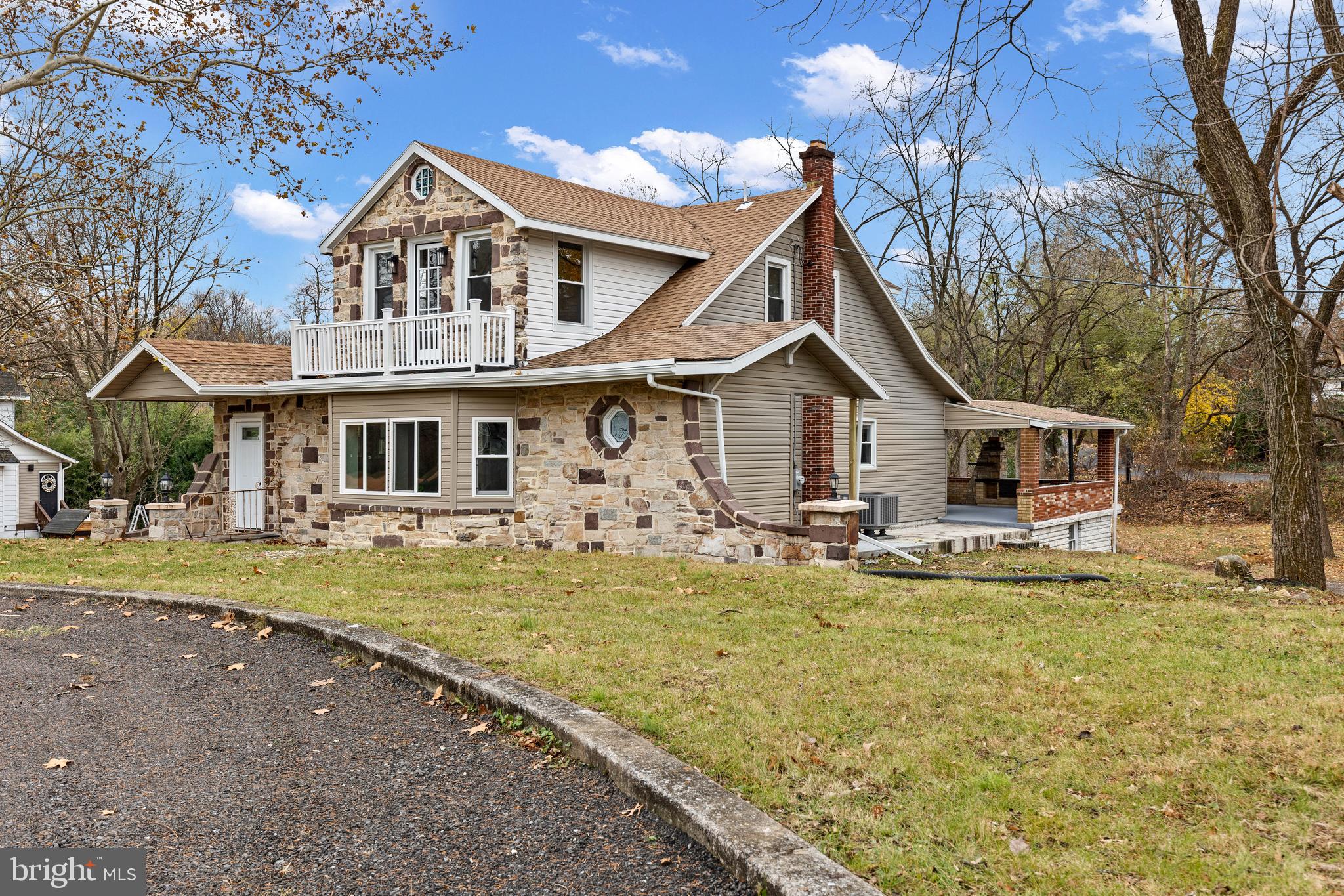 3507 Union Deposit Road Harrisburg, PA 17109 - Photo 4 of 37 a front view of a house with a garden and trees