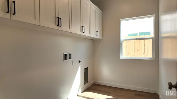 a view of cabinets and window