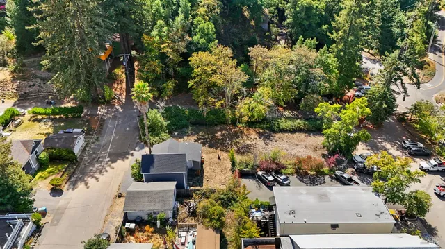 an aerial view of multiple houses with yard