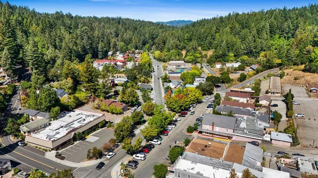 an aerial view of a house with a yard