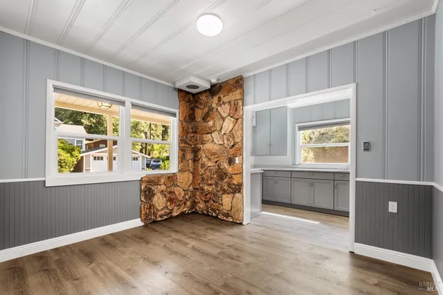 a view of room with window and hardwood floor
