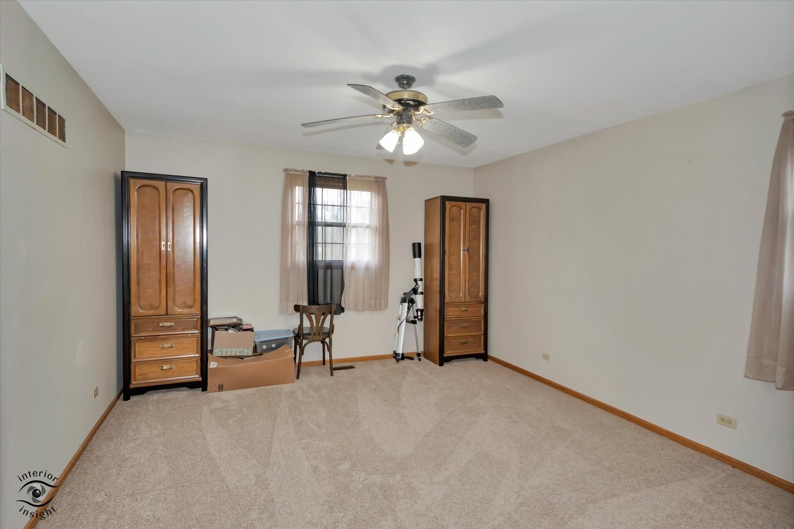 24412 Kings Road Crete, IL 60417 - Photo 10 of 28 a view of a livingroom with a chandelier fan and windows