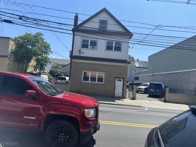 a view of a car park in front of house
