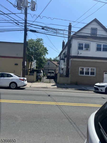 558 South Broad Street Elizabeth, NJ 07202 - Photo 2 of 4 a view of a house with a swimming pool