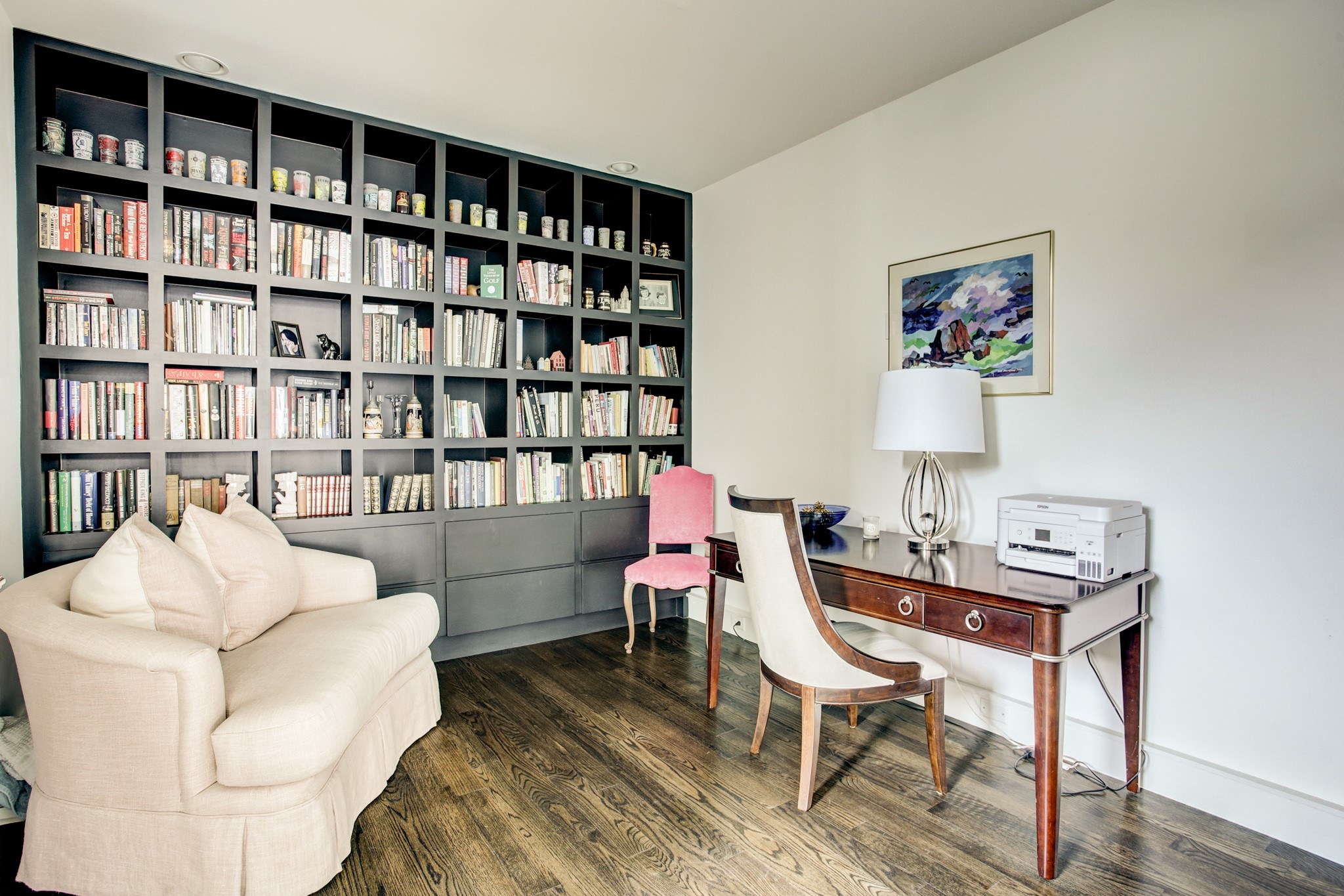 1522 Knox Street Houston, TX 77007 - Photo 20 of 43 a living room with furniture a rug and a book shelf