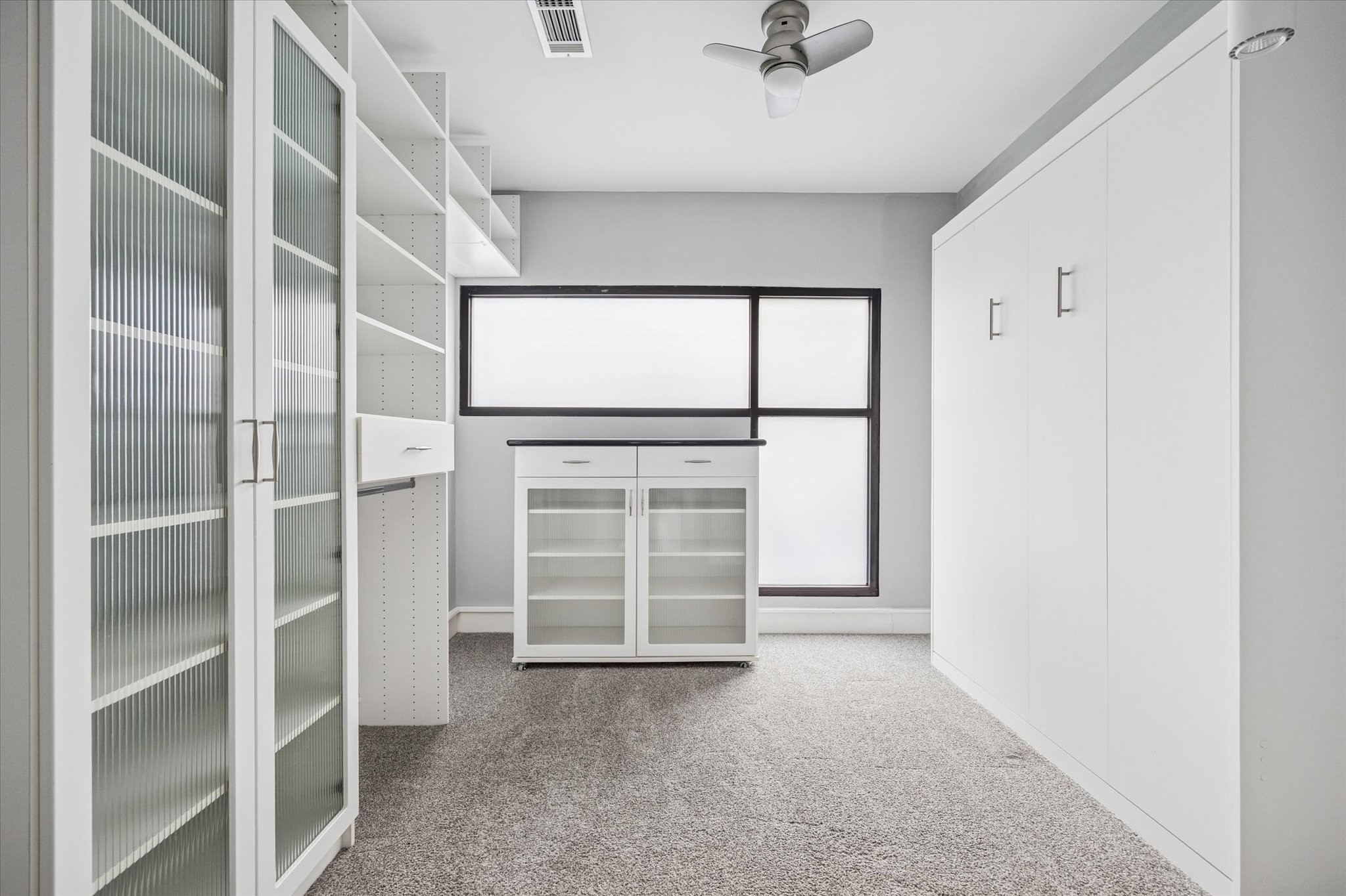 1522 Knox Street Houston, TX 77007 - Photo 30 of 43 a view of closet area with empty racks