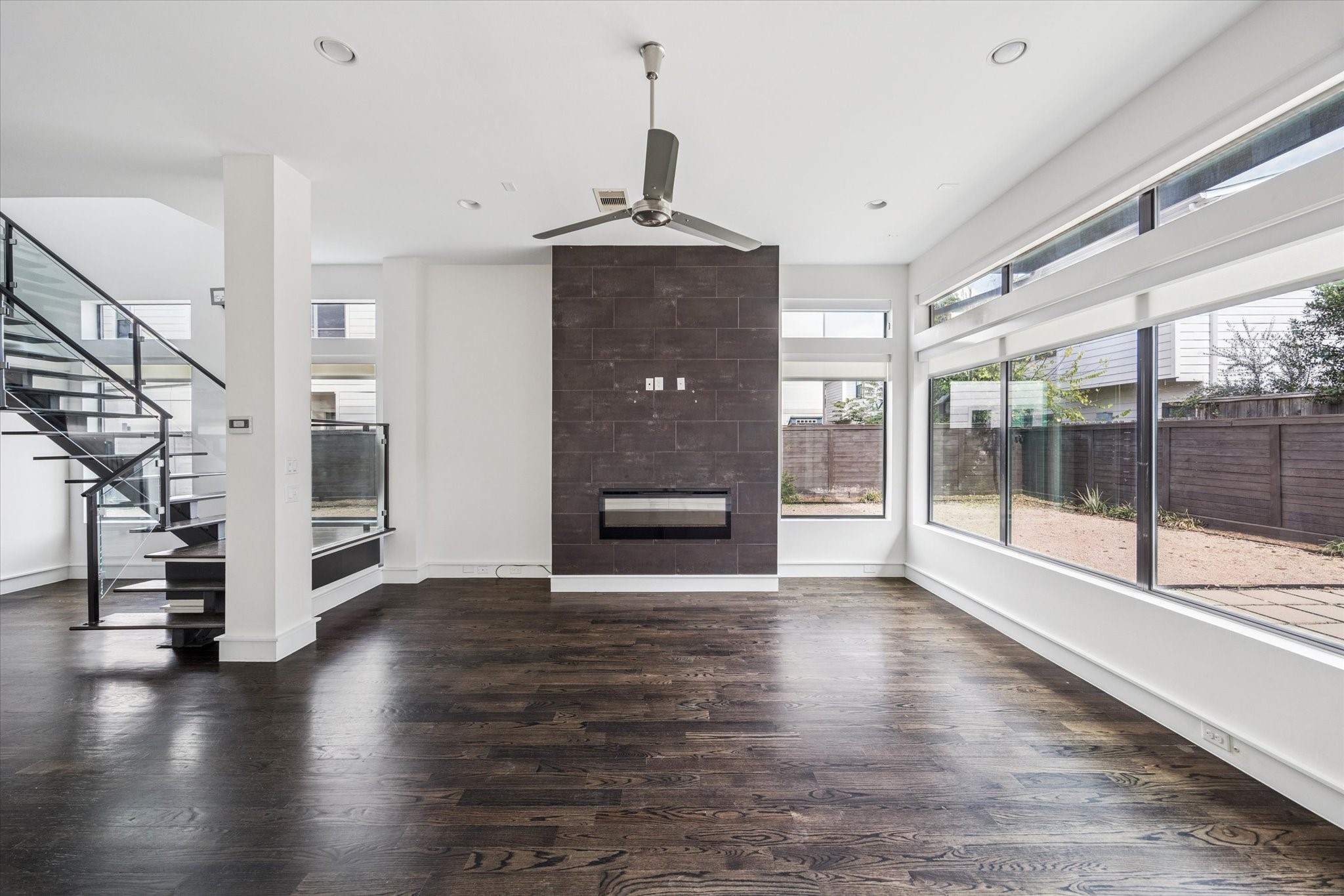 1522 Knox Street Houston, TX 77007 - Photo 37 of 43 a view of a hallway with wooden floor fireplace and windows