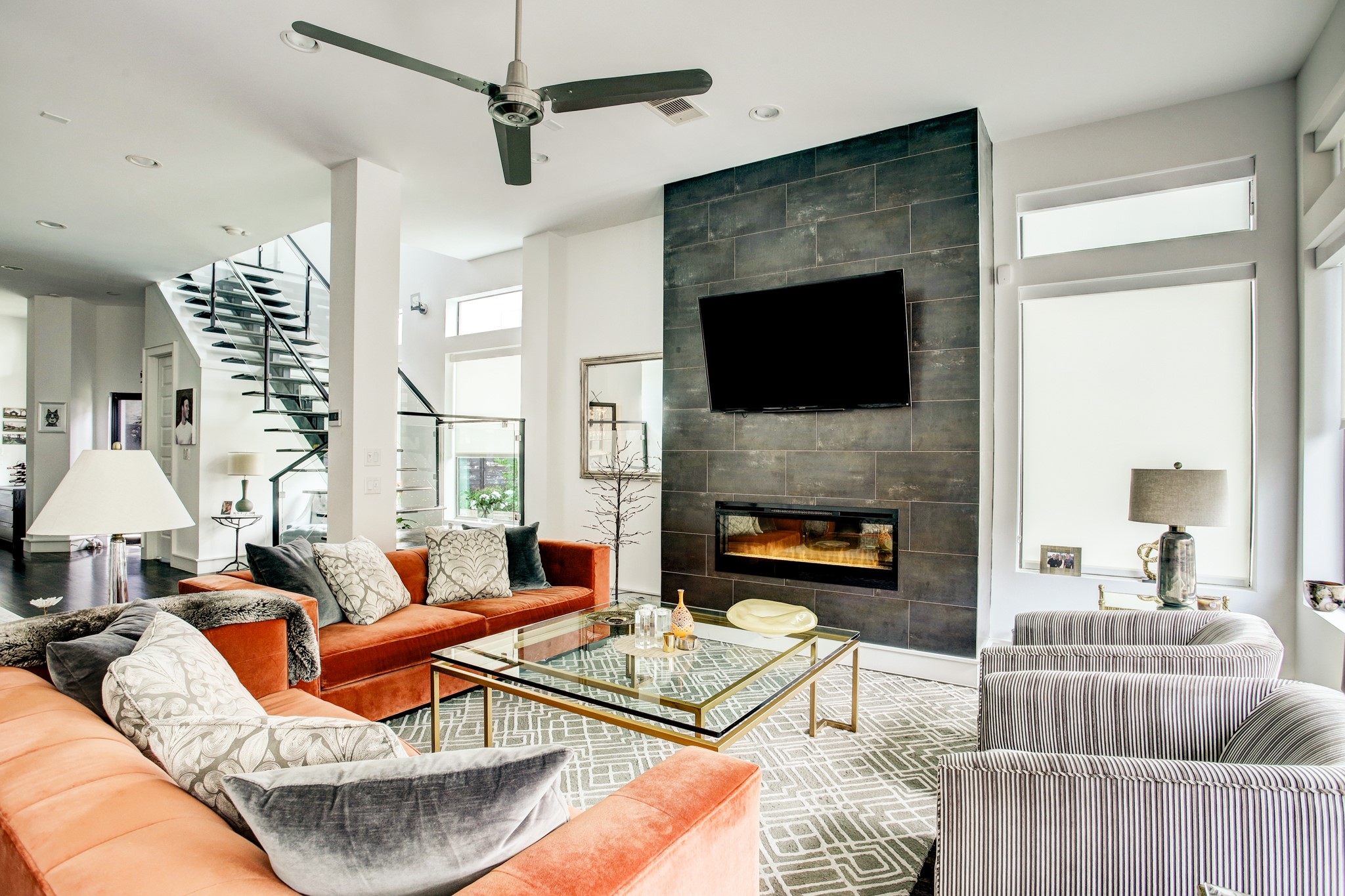 1522 Knox Street Houston, TX 77007 - Photo 7 of 43 a living room with furniture a flat screen tv and a fireplace