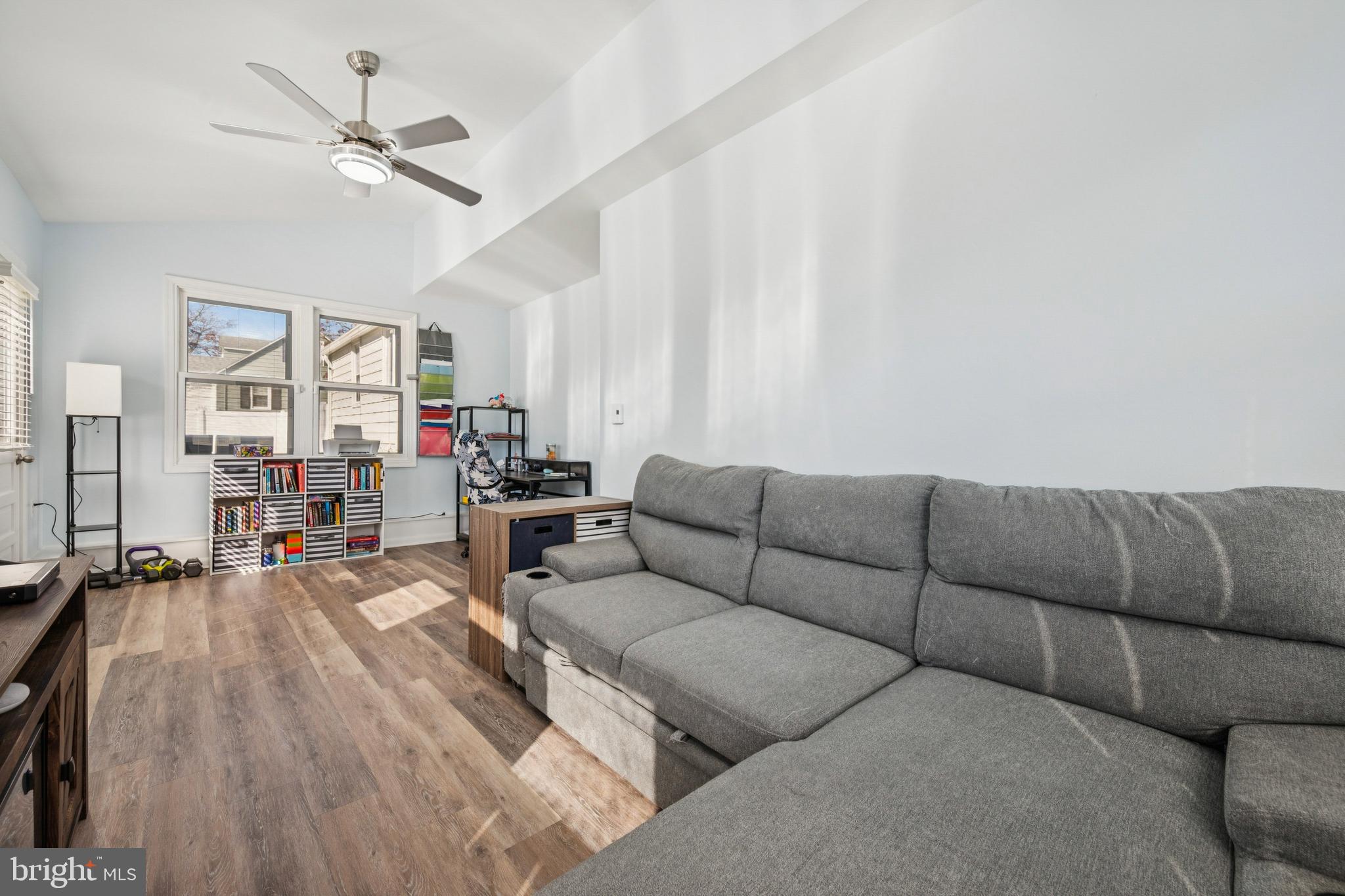 126 Repaupo Station Road Swedesboro, NJ 08085 - Photo 16 of 25 a living room with furniture kitchen view and a chandelier