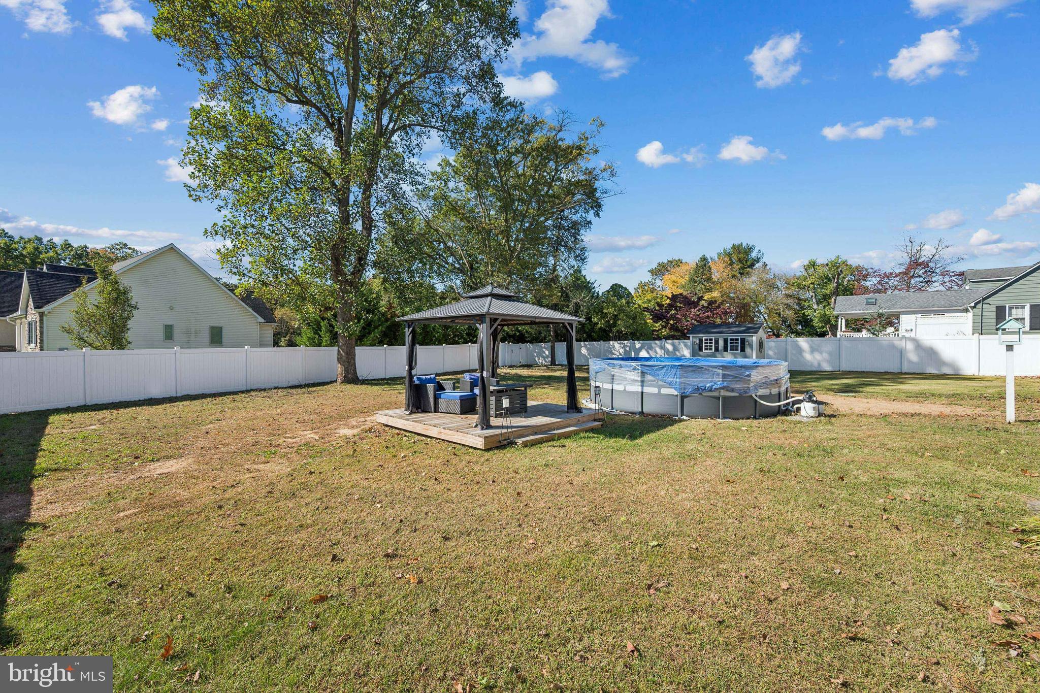 126 Repaupo Station Road Swedesboro, NJ 08085 - Photo 22 of 25 a swimming pool with some trees in the background