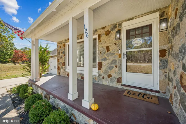 a view of an outdoor space and porch with furniture