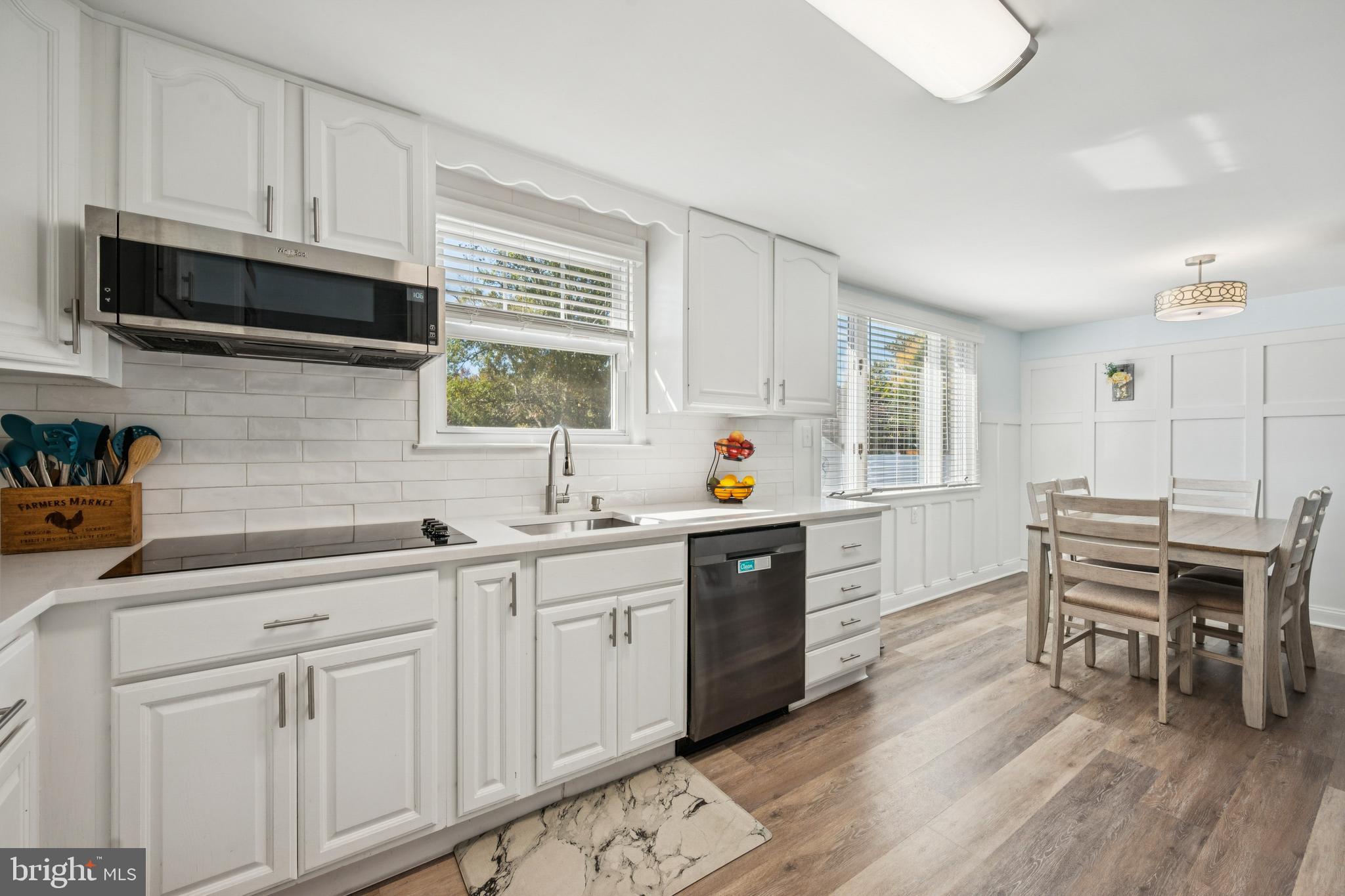 126 Repaupo Station Road Swedesboro, NJ 08085 - Photo 3 of 25 a kitchen with sink cabinets and dining table chair