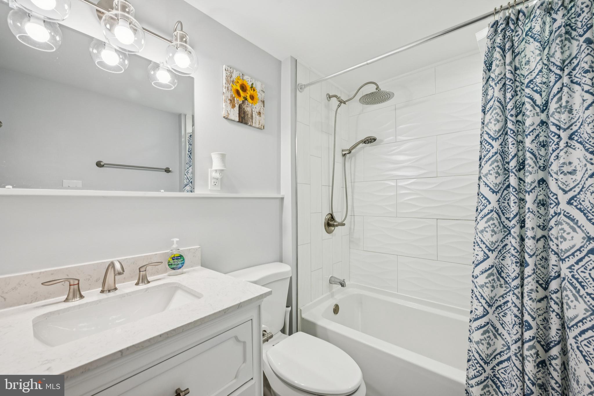 126 Repaupo Station Road Swedesboro, NJ 08085 - Photo 7 of 25 a bathroom with a sink a toilet and shower