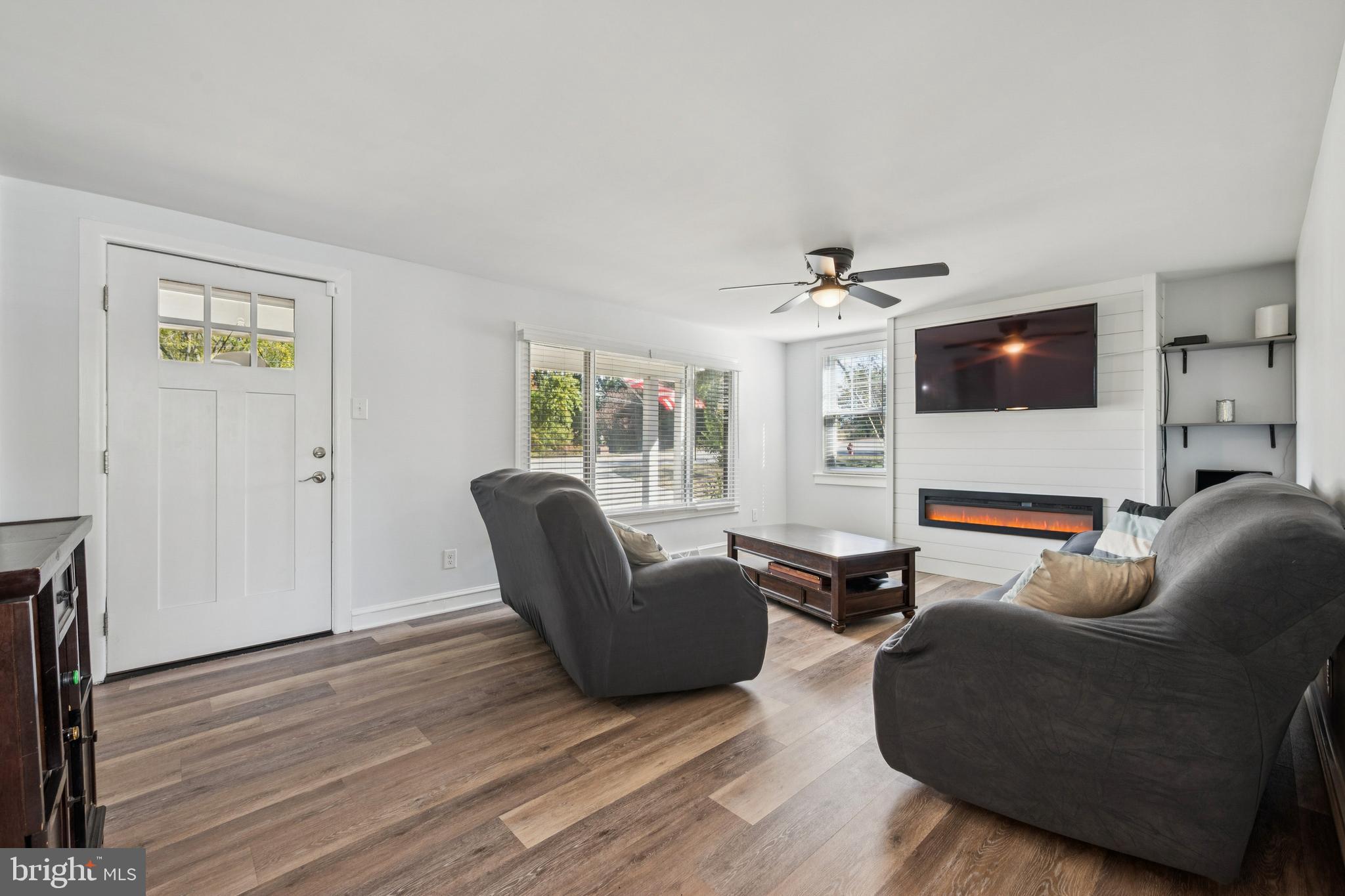 126 Repaupo Station Road Swedesboro, NJ 08085 - Photo 9 of 25 a living room with furniture and a flat screen tv