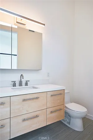 a bathroom with a sink a mirror and a bathtub