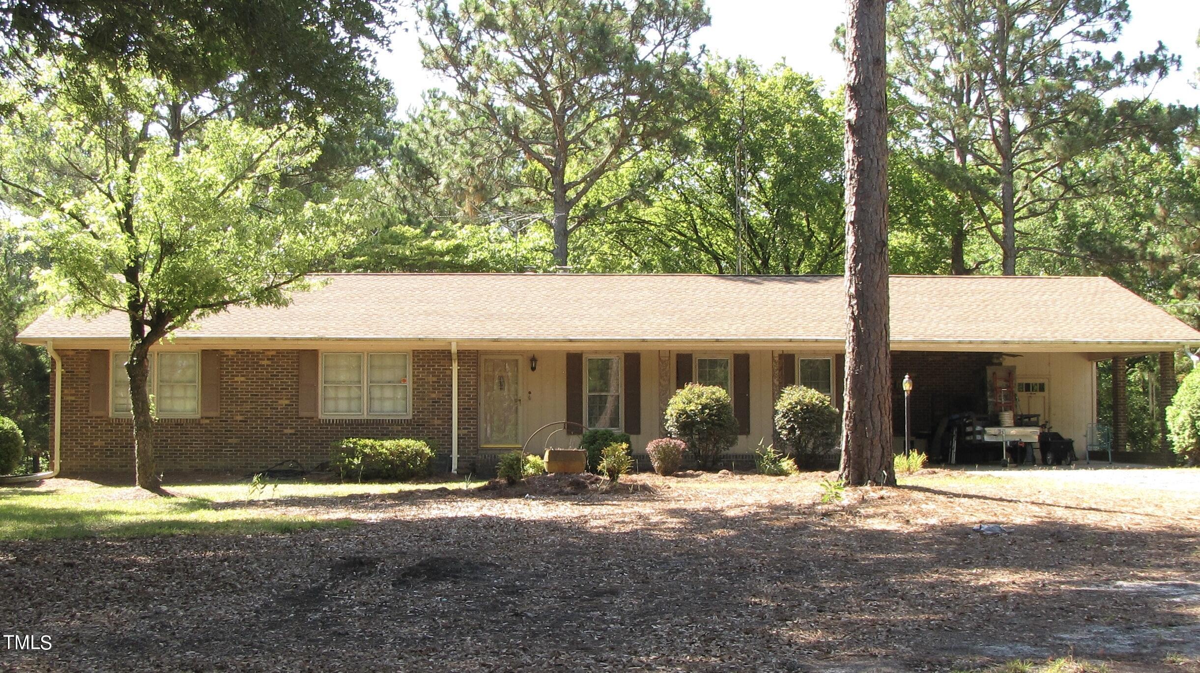 376 Hennings Drive Vass, NC 28394 - Photo 1 of 23 a front view of a house with a yard and garage