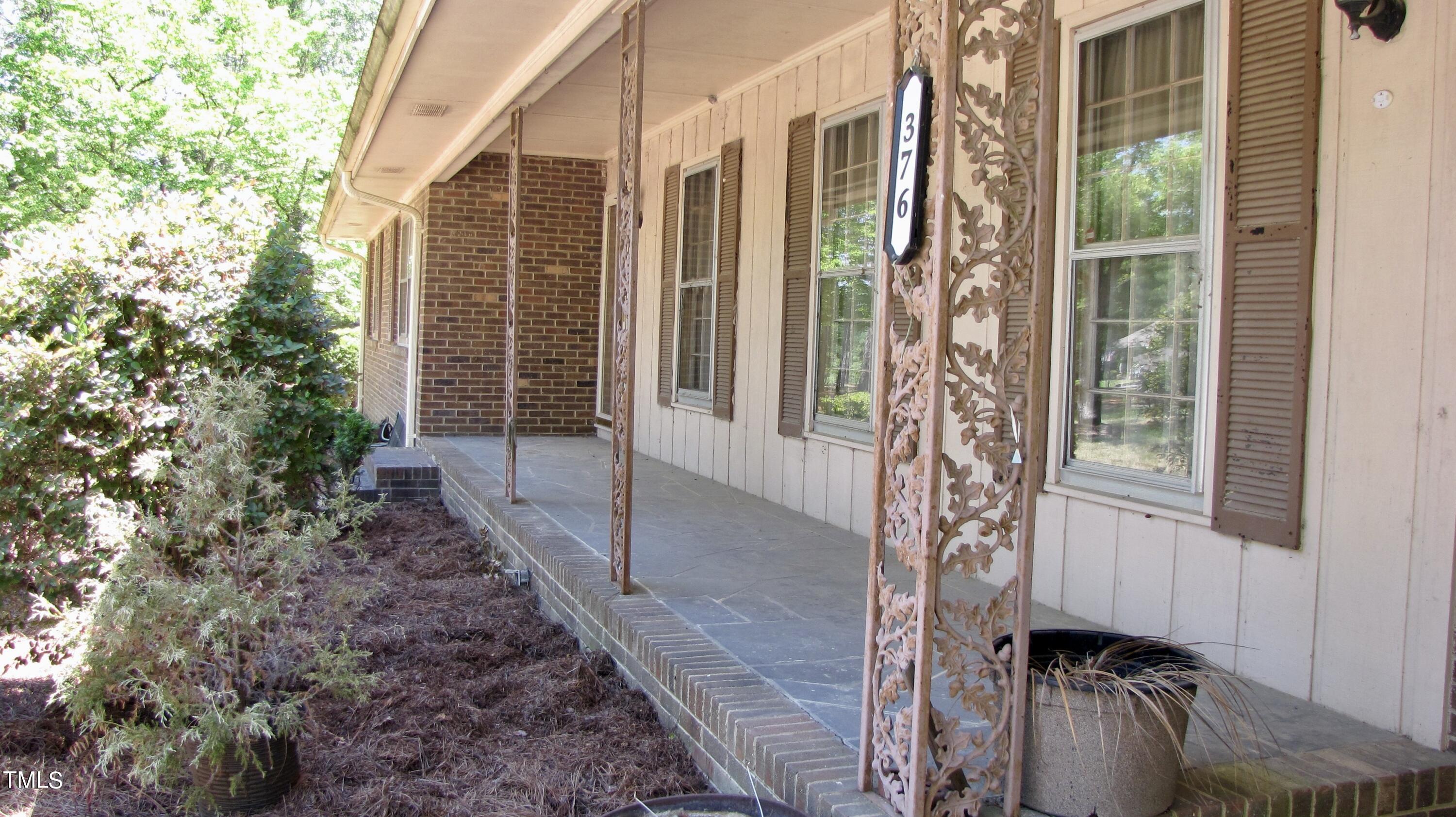 376 Hennings Drive Vass, NC 28394 - Photo 4 of 23 a house view with a garden space