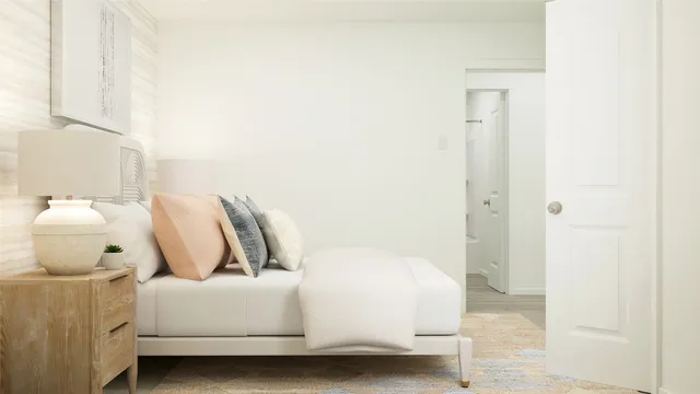 a bedroom with a bed and a mirror