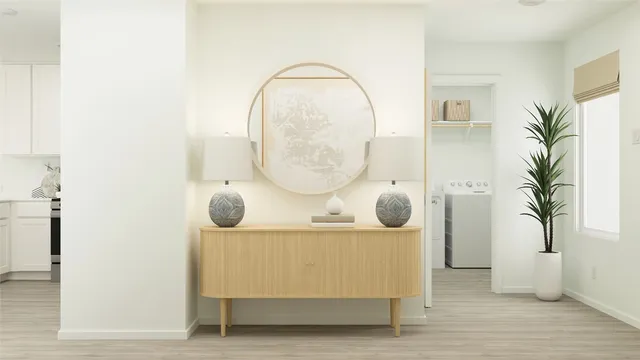 a living room with furniture and a mirror